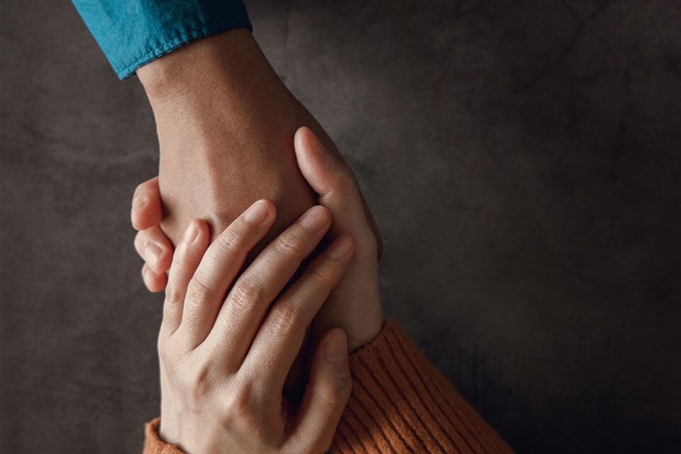Low trauma holding hands grief direct cremation service Ireland
