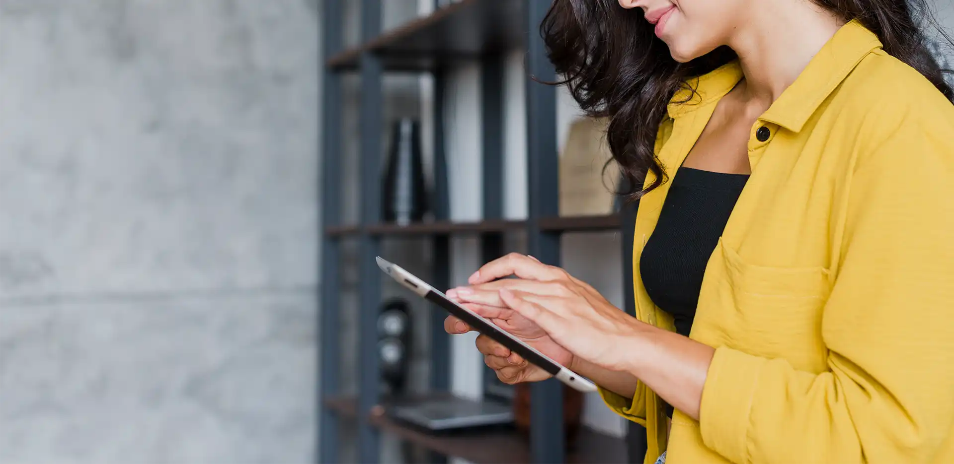 Young woman using a device to calculate funeral costs Simple Cremation modern funeral Ireland